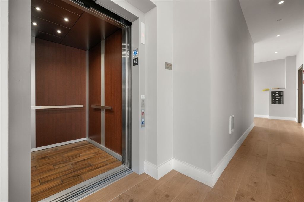 Elevator, Interior, Recessed Lighting, Wood Texture Flooring, Wooden Walls