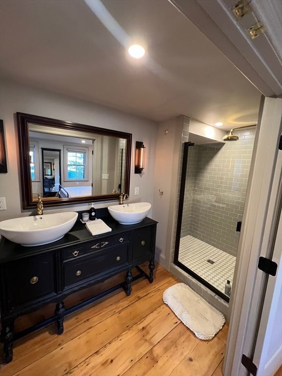 Bathroom, Dual Sink Vanities, Glass Shower, Interior, Recessed Lighting, Wood Texture Flooring