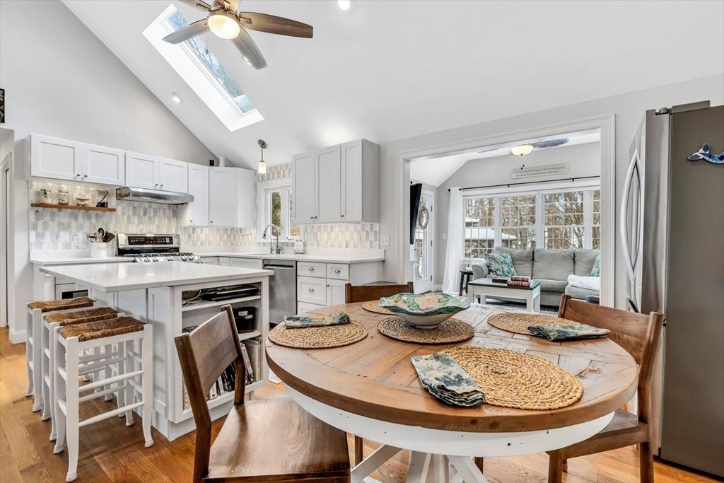 Dining room, Interior, Kitchen, Living room, Recessed Lighting, Stainless Steel Appliances, Wood Texture Flooring