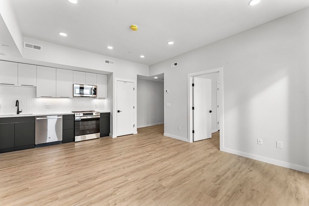 Interior, Kitchen, Recessed Lighting, Stainless Steel Appliances, Wood Texture Flooring