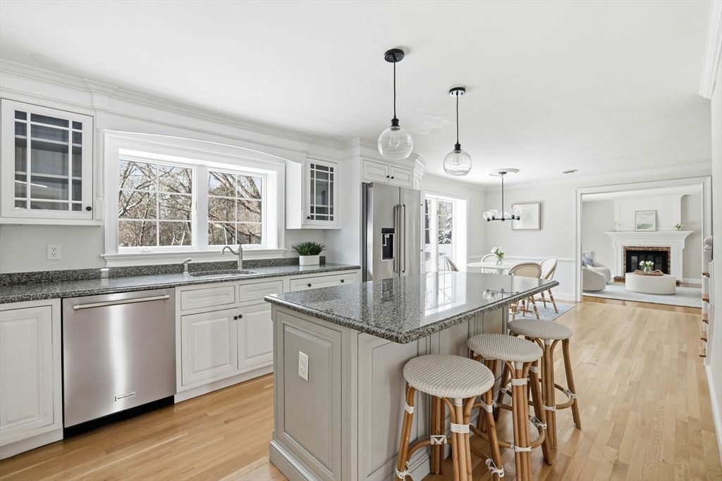 Dining room, Fireplace, Interior, Kitchen, Pendant Lights, Stainless Steel Appliances, Wood Texture Flooring