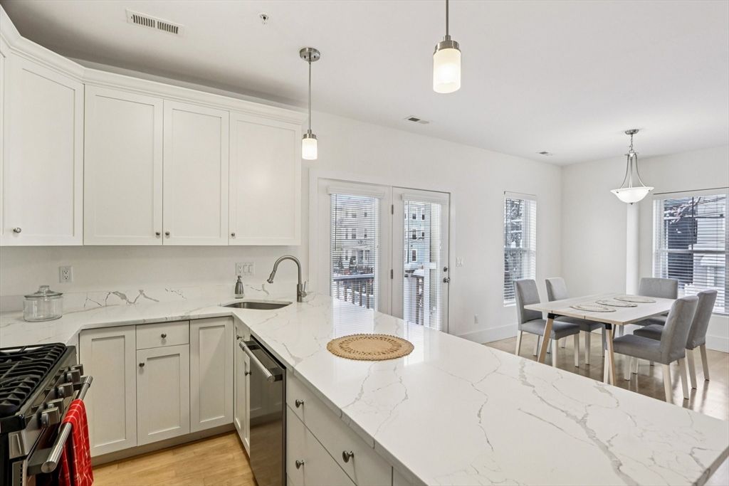 Dining room, Interior, Kitchen, Pendant Lights, Recessed Lighting, Stainless Steel Appliances, Wood Texture Flooring