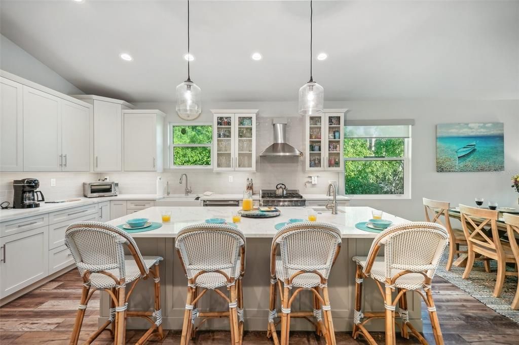 Dining room, Interior, Kitchen, Pendant Lights, Recessed Lighting, Stainless Steel Appliances, Wood Texture Flooring