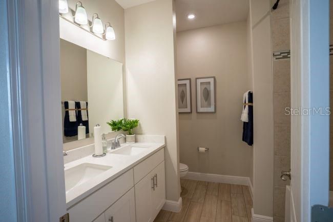 Bathroom, Dual Sink Vanities, Interior, Recessed Lighting, Wood Texture Flooring