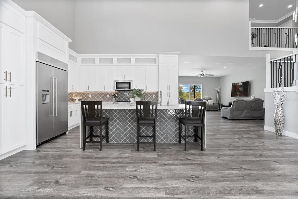 Dining room, Interior, Kitchen, Living room, Recessed Lighting, Stainless Steel Appliances, Wood Texture Flooring