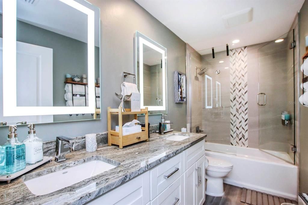 Bathroom, Dual Sink Vanities, Glass Shower, Interior, Recessed Lighting, Wood Texture Flooring