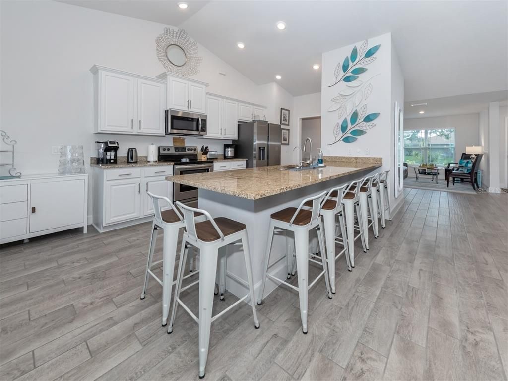 Dining room, Interior, Kitchen, Recessed Lighting, Stainless Steel Appliances, Wood Texture Flooring