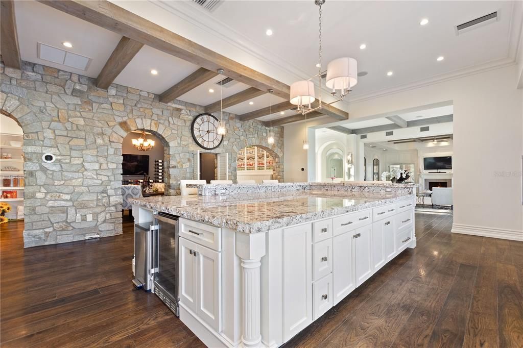 Interior, Kitchen, Pendant Lights, Recessed Lighting, Stainless Steel Appliances, Stone Walls, Wooden Beams, Wood Texture Flooring