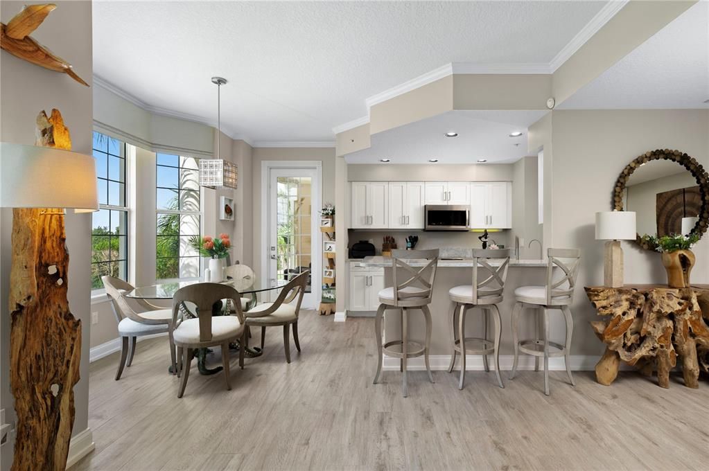 Dining room, Interior, Kitchen, Pendant Lights, Recessed Lighting, Stainless Steel Appliances, Wood Texture Flooring