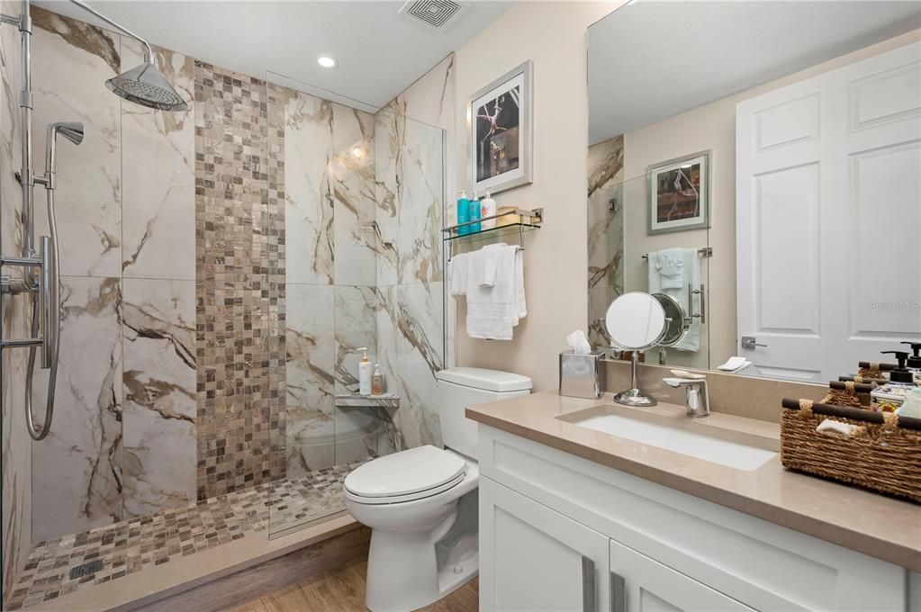 Bathroom, Glass Shower, Interior, Marble Walls, Recessed Lighting, Wood Texture Flooring