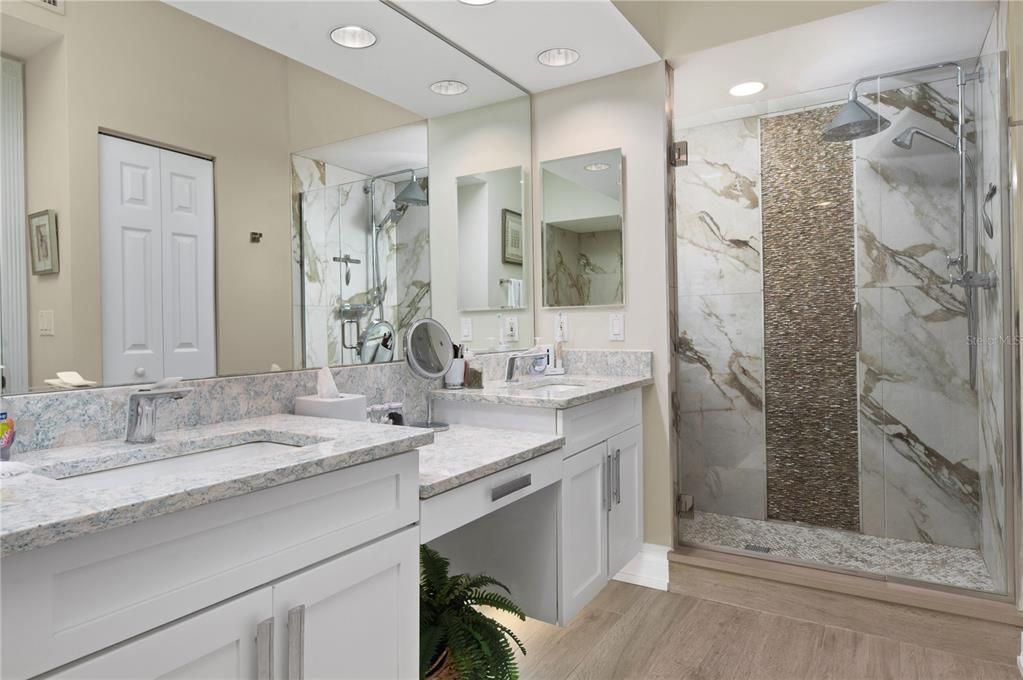 Bathroom, Dual Sink Vanities, Glass Shower, Interior, Marble Walls, Recessed Lighting, Wood Texture Flooring