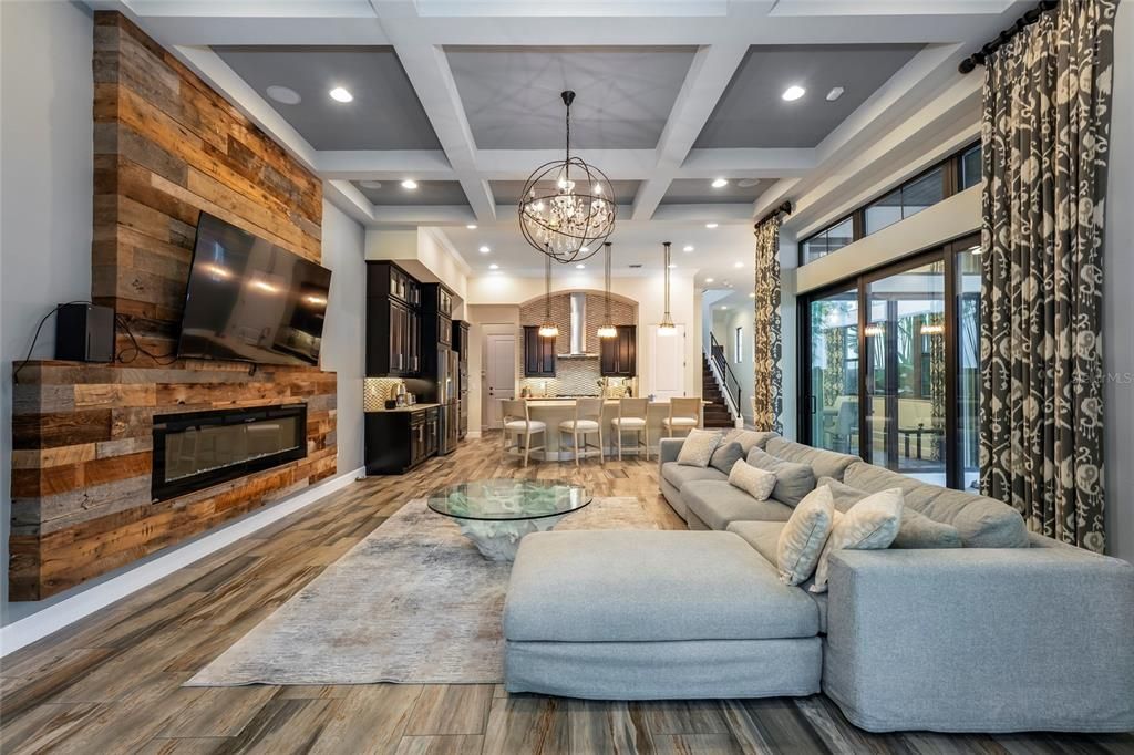 Chandelier, Dining room, Fireplace, Interior, Kitchen, Living room, Pendant Lights, Recessed Lighting, Wood Texture Flooring, Wooden Walls
