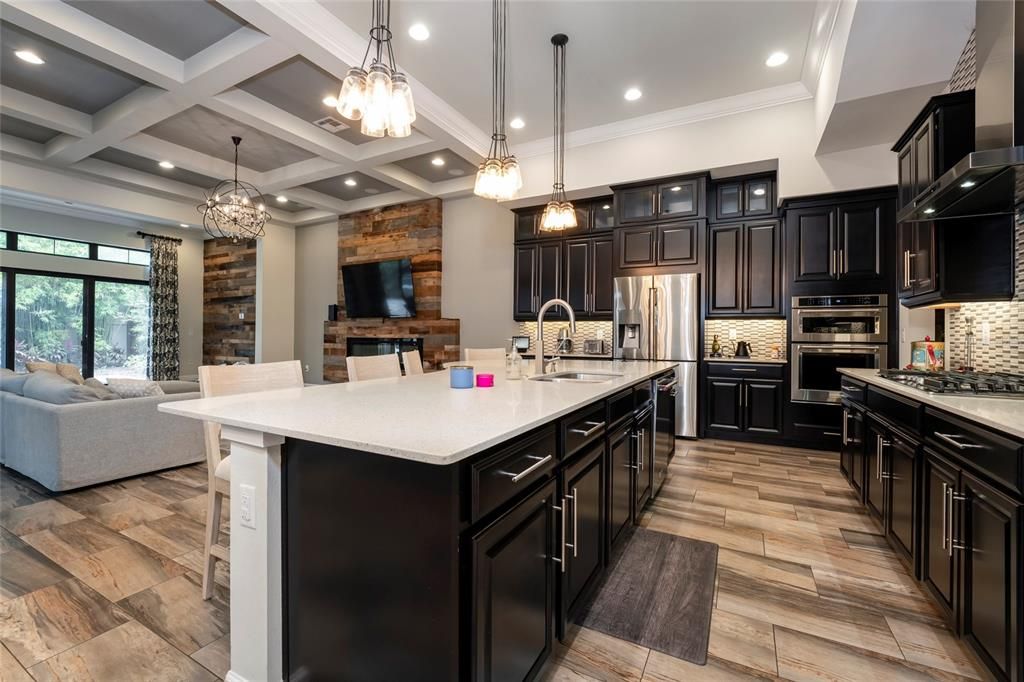 Chandelier, Interior, Kitchen, Living room, Pendant Lights, Recessed Lighting, Stainless Steel Appliances, Wood Texture Flooring
