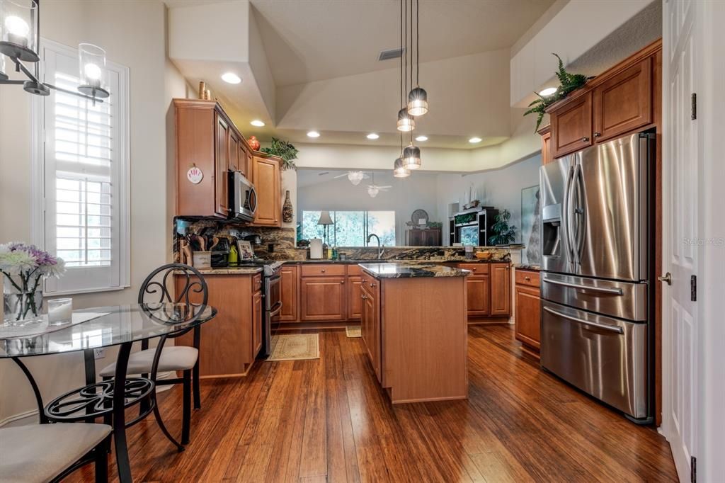 Dining room, Interior, Kitchen, Pendant Lights, Recessed Lighting, Stainless Steel Appliances, Wood Texture Flooring