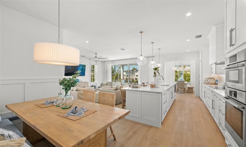 Dining room, Interior, Kitchen, Living room, Pendant Lights, Recessed Lighting, Stainless Steel Appliances, Wood Texture Flooring