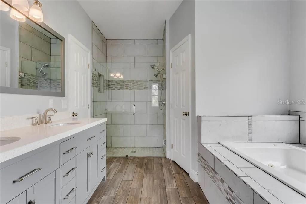 Bathroom, Dual Sink Vanities, Glass Shower, Interior, Tile Countertops, Wood Texture Flooring