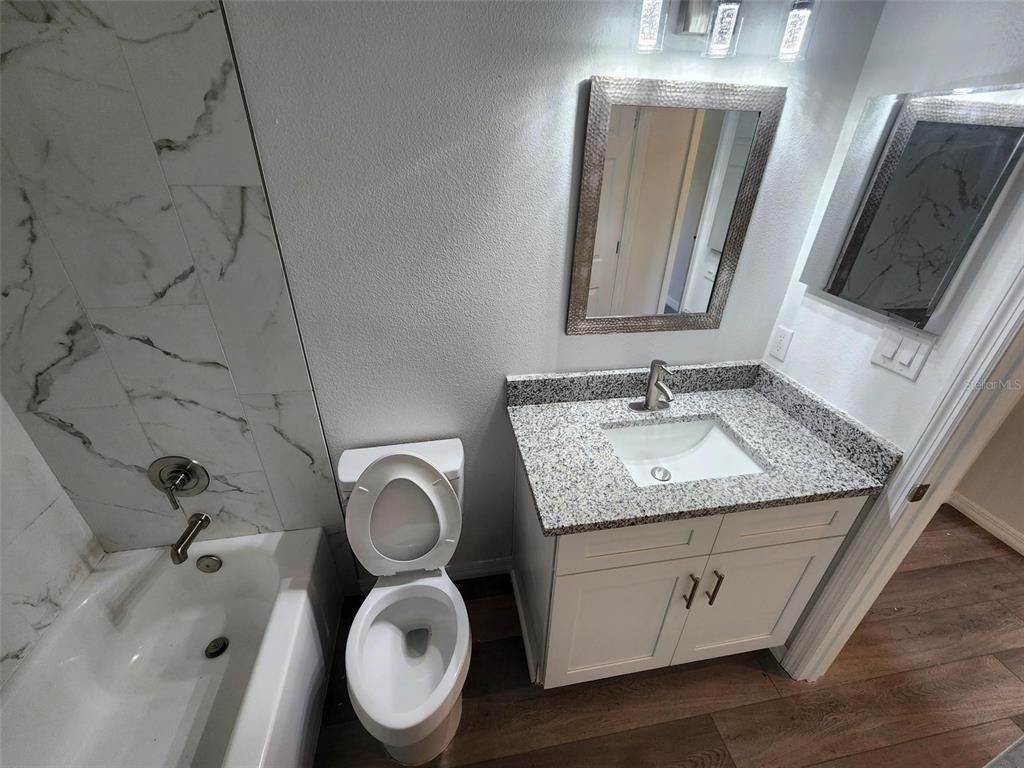 Bathroom, Dual Sink Vanities, Interior, Marble Walls, Wood Texture Flooring