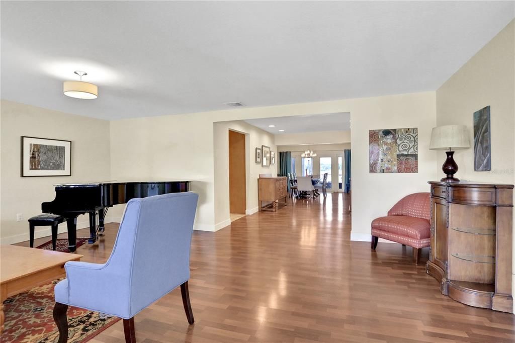 Dining room, Interior, Pendant Lights, Piano, Wood Texture Flooring