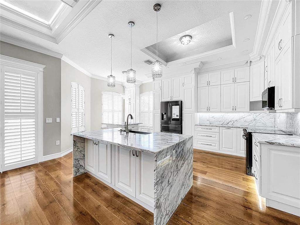 Interior, Kitchen, Marble Walls, Pendant Lights, Recessed Lighting, Wood Texture Flooring