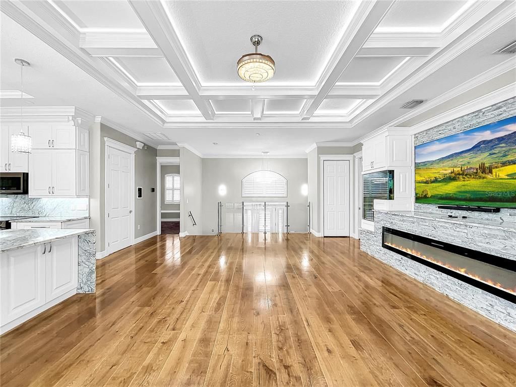 Empty room, Fireplace, Interior, Kitchen, Pendant Lights, Wood Texture Flooring