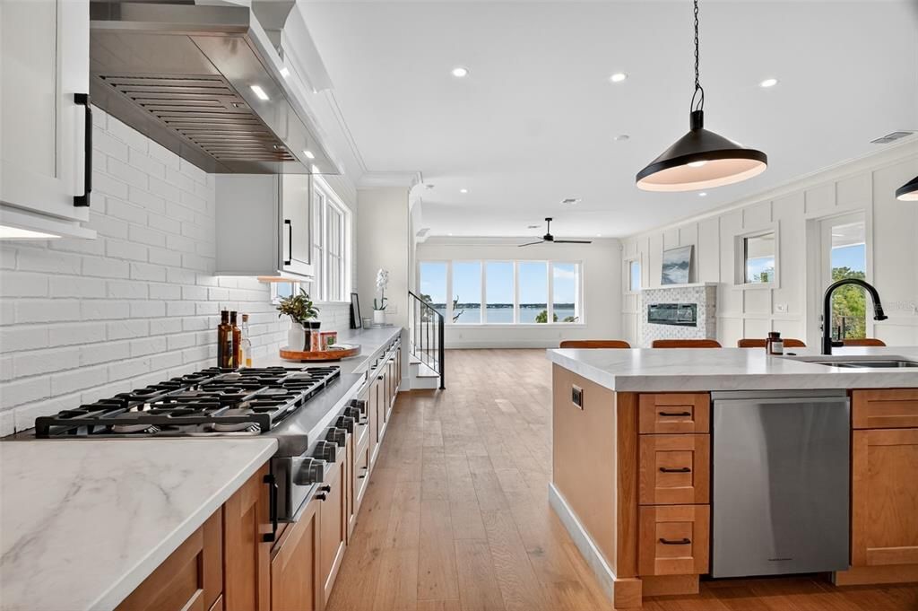 Fireplace, Interior, Kitchen, Pendant Lights, Recessed Lighting, Stainless Steel Appliances, Wood Texture Flooring