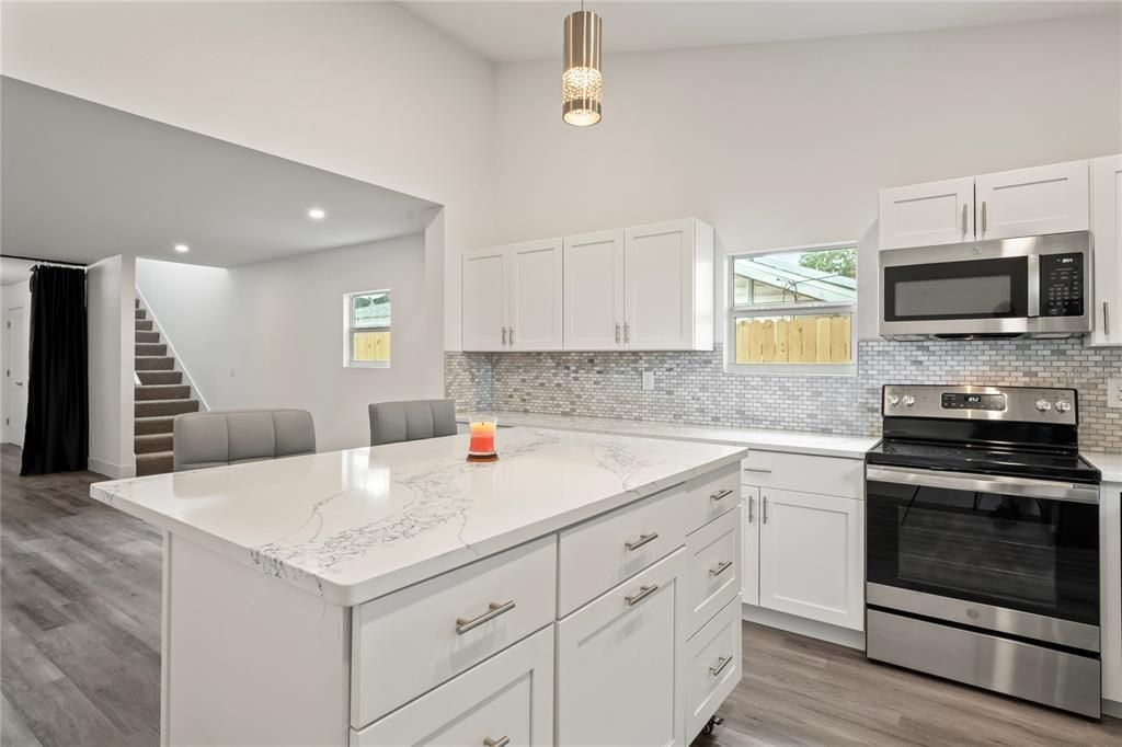 Interior, Kitchen, Pendant Lights, Recessed Lighting, Stainless Steel Appliances, Wood Texture Flooring
