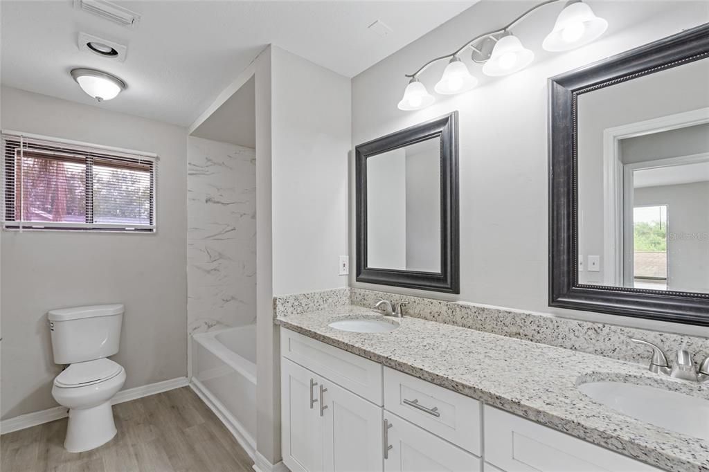 Bathroom, Dual Sink Vanities, Interior, Marble Walls, Wood Texture Flooring