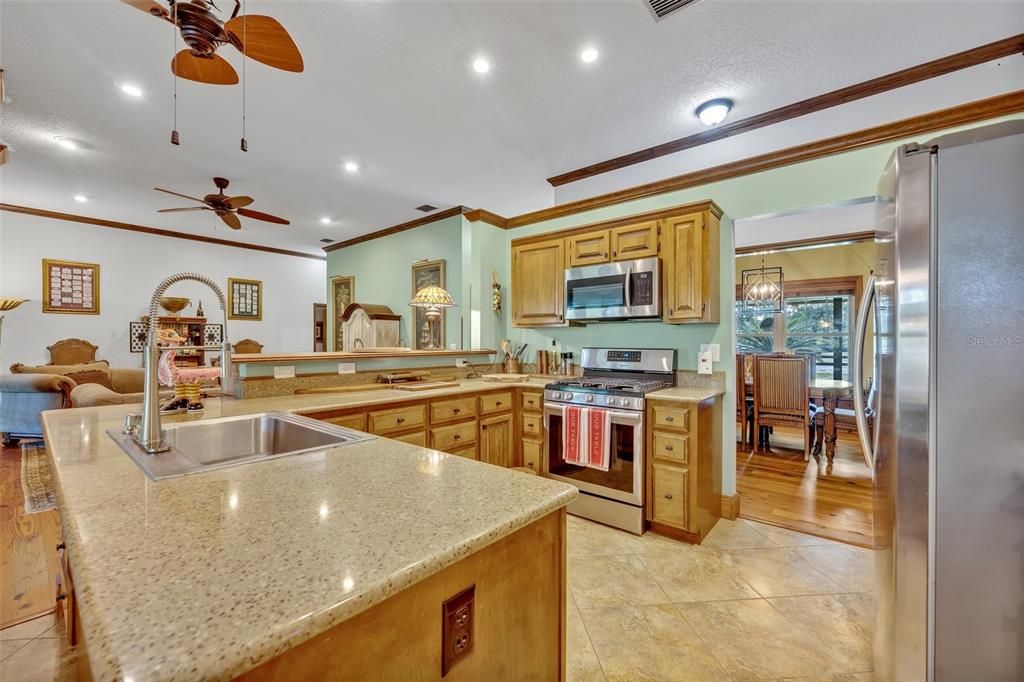 Dining room, Interior, Kitchen, Recessed Lighting, Stainless Steel Appliances, Wood Texture Flooring