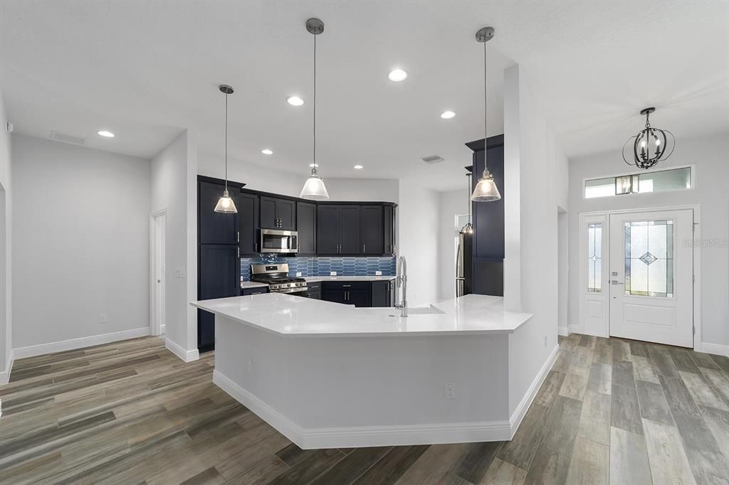 Interior, Kitchen, Pendant Lights, Recessed Lighting, Stainless Steel Appliances, Wood Texture Flooring