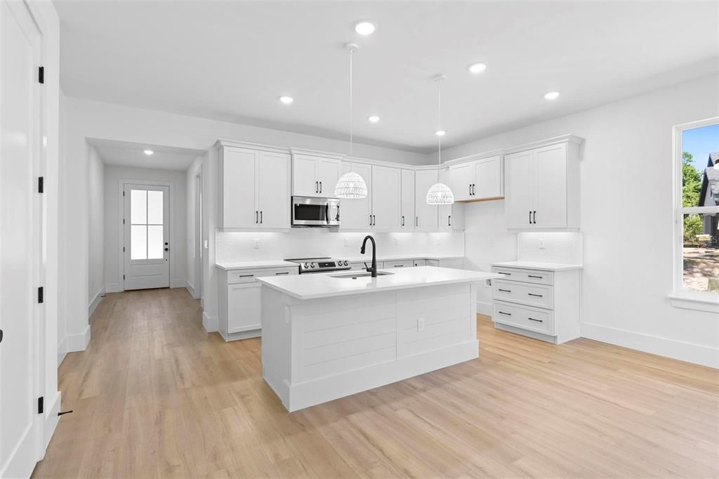 Interior, Kitchen, Pendant Lights, Recessed Lighting, Stainless Steel Appliances, Wood Texture Flooring