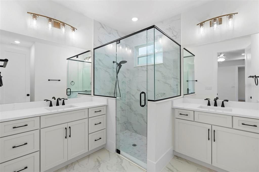 Bathroom, Dual Sink Vanities, Glass Shower, Interior, Marble, Marble Walls, Recessed Lighting