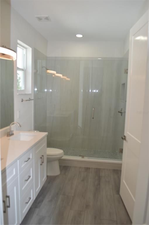 Bathroom, Glass Shower, Interior, Recessed Lighting, Wood Texture Flooring