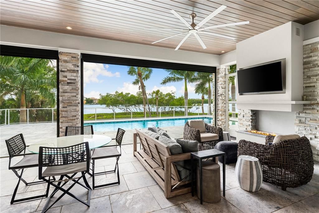 Fireplace, Interior, Living room, Recessed Lighting, Stone Walls, Water, Wooden Ceilings