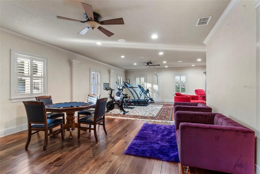 Dining room, Fitness Equipment, Game Room, Interior, Living room, Recessed Lighting, Wood Texture Flooring