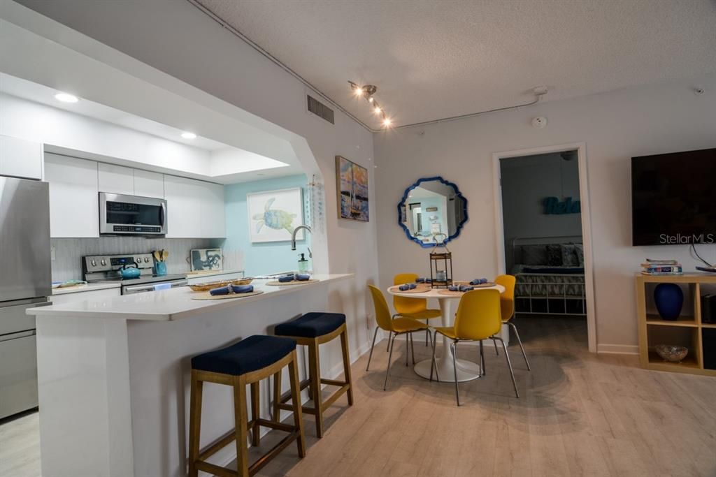 Dining room, Interior, Kitchen, Recessed Lighting, Stainless Steel Appliances, Wood Texture Flooring