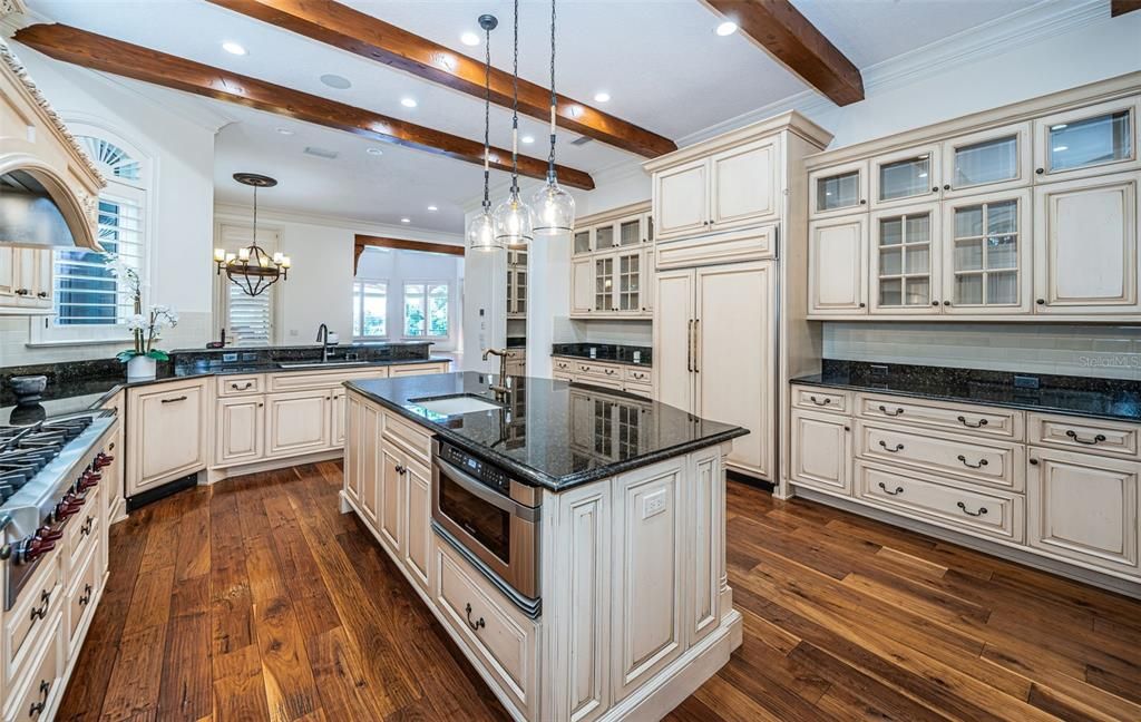 Chandelier, Interior, Kitchen, Pendant Lights, Recessed Lighting, Stainless Steel Appliances, Wooden Beams, Wood Texture Flooring