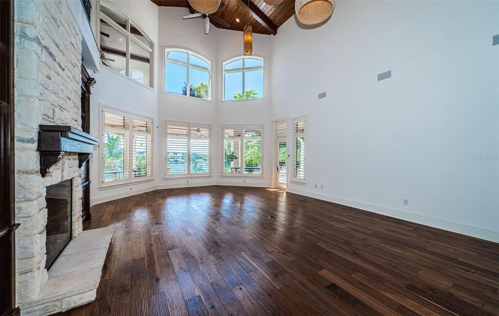 Empty room, Fireplace, Interior, Recessed Lighting, Stone Walls, Wooden Beams, Wooden Ceilings, Wood Texture Flooring