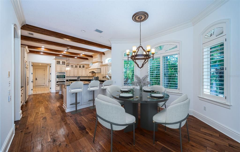 Chandelier, Dining room, Interior, Kitchen, Pendant Lights, Recessed Lighting, Stainless Steel Appliances, Wooden Beams, Wood Texture Flooring