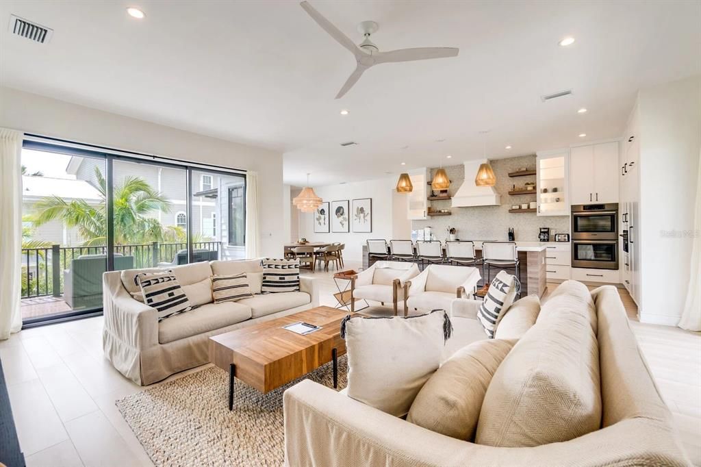 Dining room, Interior, Kitchen, Living room, Pendant Lights, Recessed Lighting, Stainless Steel Appliances, Wood Texture Flooring