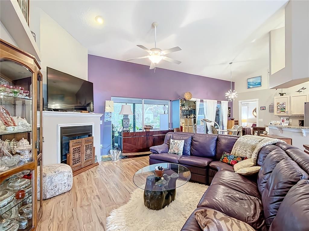 Chandelier, Dining room, Fireplace, Interior, Living room, Recessed Lighting, Wood Texture Flooring
