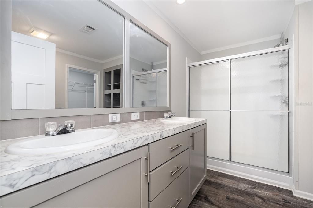 Bathroom, Dual Sink Vanities, Glass Shower, Interior, Recessed Lighting, Wood Texture Flooring