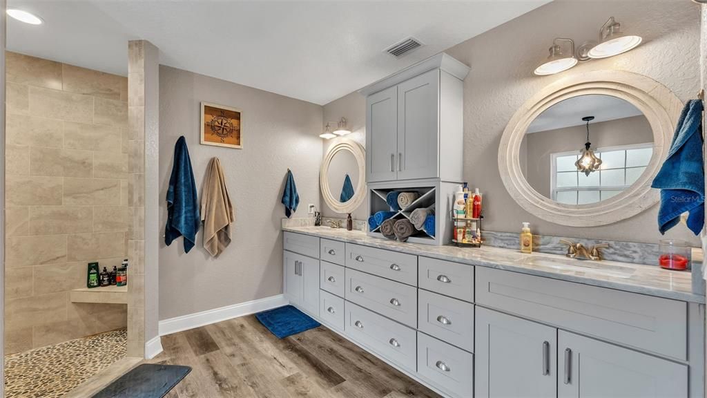 Bathroom, Dual Sink Vanities, Interior, Pendant Lights, Recessed Lighting, Wood Texture Flooring