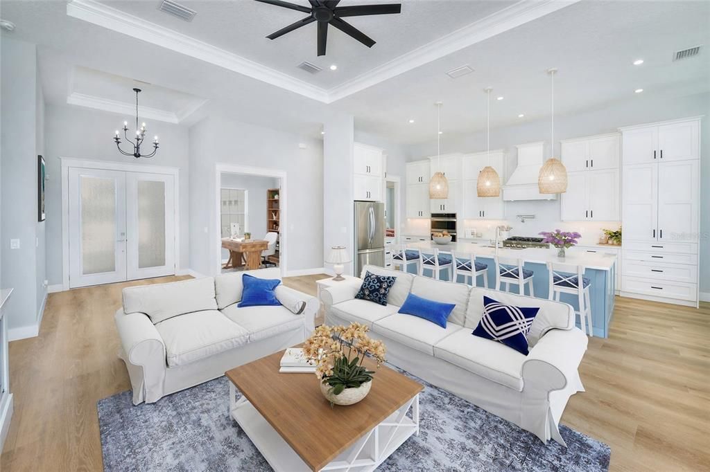 Chandelier, Interior, Kitchen, Living room, Pendant Lights, Recessed Lighting, Stainless Steel Appliances, Wood Texture Flooring