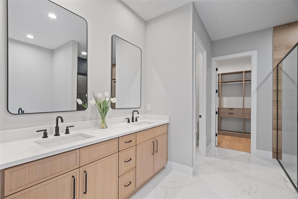 Bathroom, Dual Sink Vanities, Interior, Marble, Recessed Lighting, Walk-in Closets