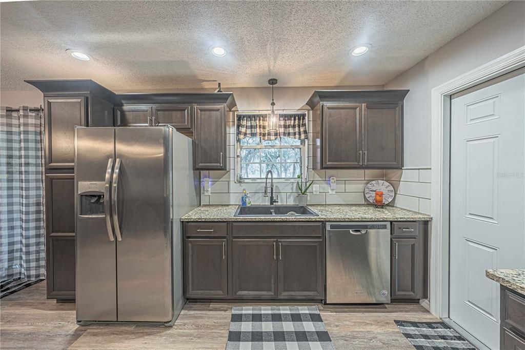 Chandelier, Interior, Kitchen, Pendant Lights, Recessed Lighting, Stainless Steel Appliances, Wood Texture Flooring