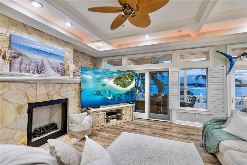 Fireplace, Interior, Recessed Lighting, Stone Walls, Water, Wood Texture Flooring