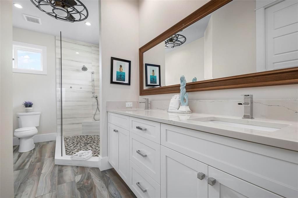 Bathroom, Dual Sink Vanities, Glass Shower, Interior, Recessed Lighting, Wood Texture Flooring