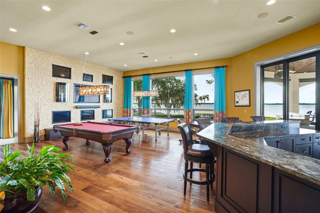 Billiard Table, Fireplace, Game Room, Interior, Pendant Lights, Recessed Lighting, Water, Wood Texture Flooring