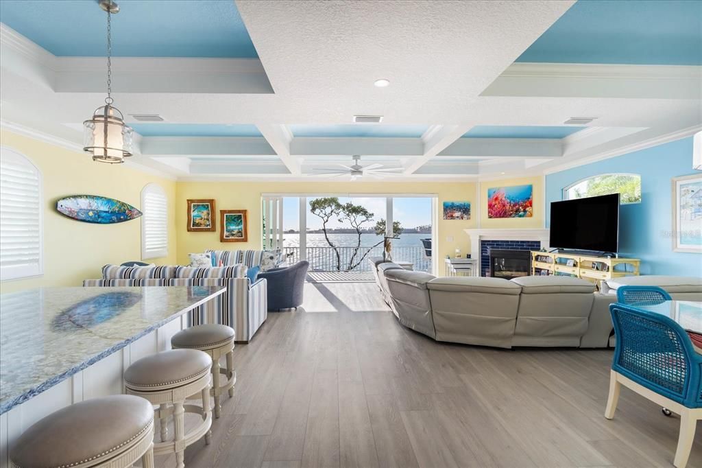 Fireplace, Interior, Living room, Pendant Lights, Recessed Lighting, Water, Wood Texture Flooring