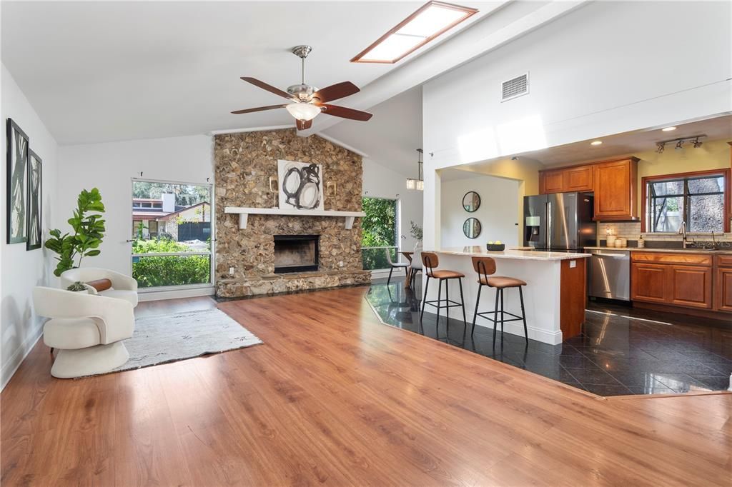 Fireplace, Interior, Kitchen, Recessed Lighting, Stainless Steel Appliances, Stone Walls, Wood Texture Flooring